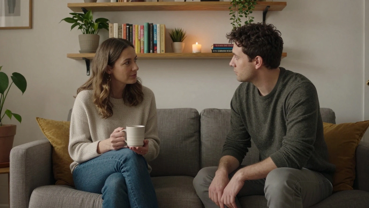 A woman and client sitting quietly in a warm room, engaged in thoughtful conversation with no physical contact.